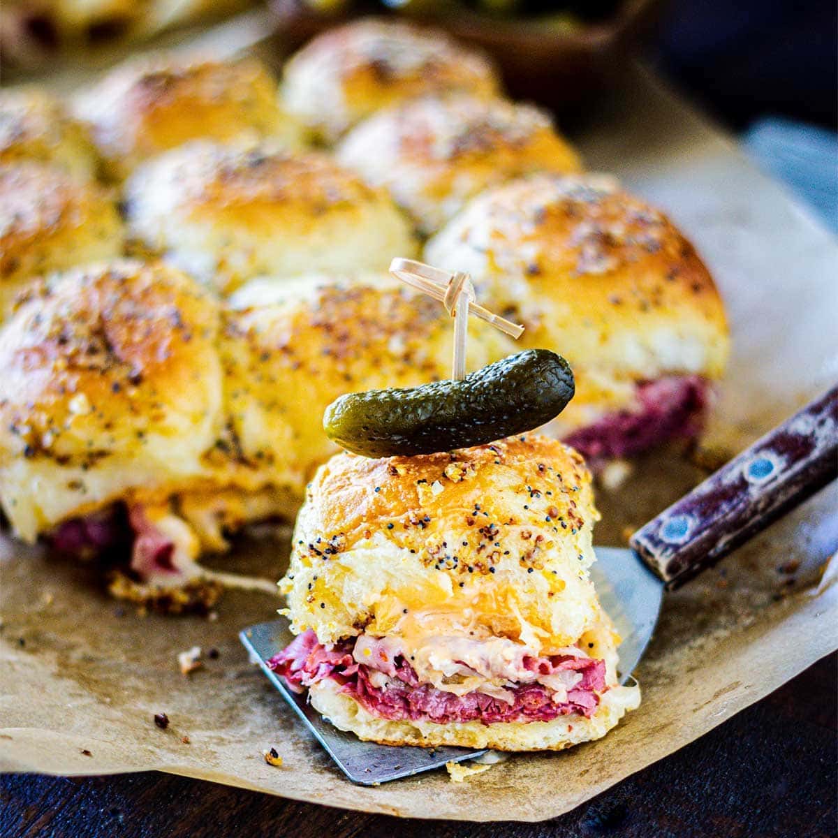 A close-up of baked Reuben sandwich.