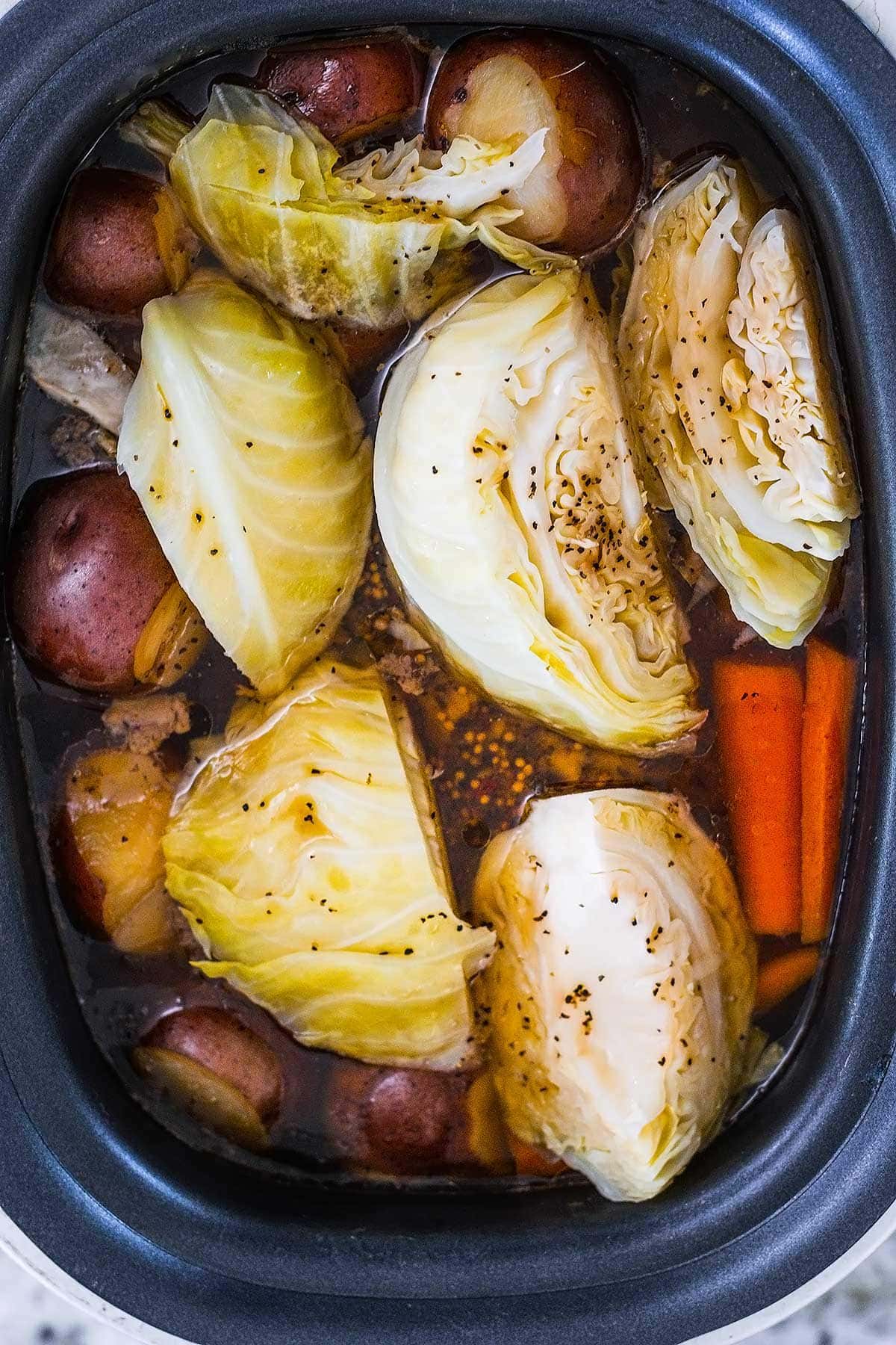 Corned beef and cabbage in a slow cooker.