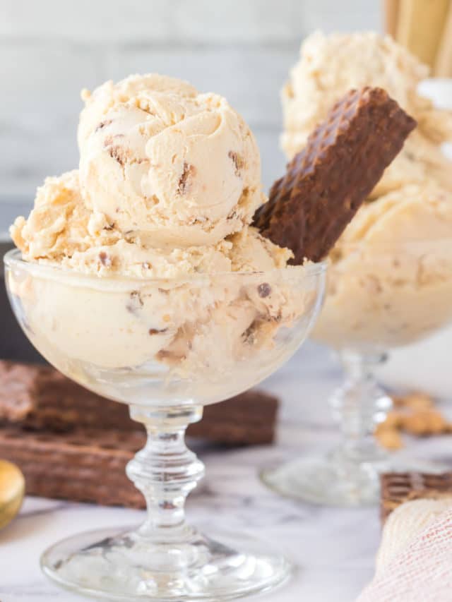 Scoops of nutty buddy ice cream in a glass dessert cup garnished with a nutty buddy.