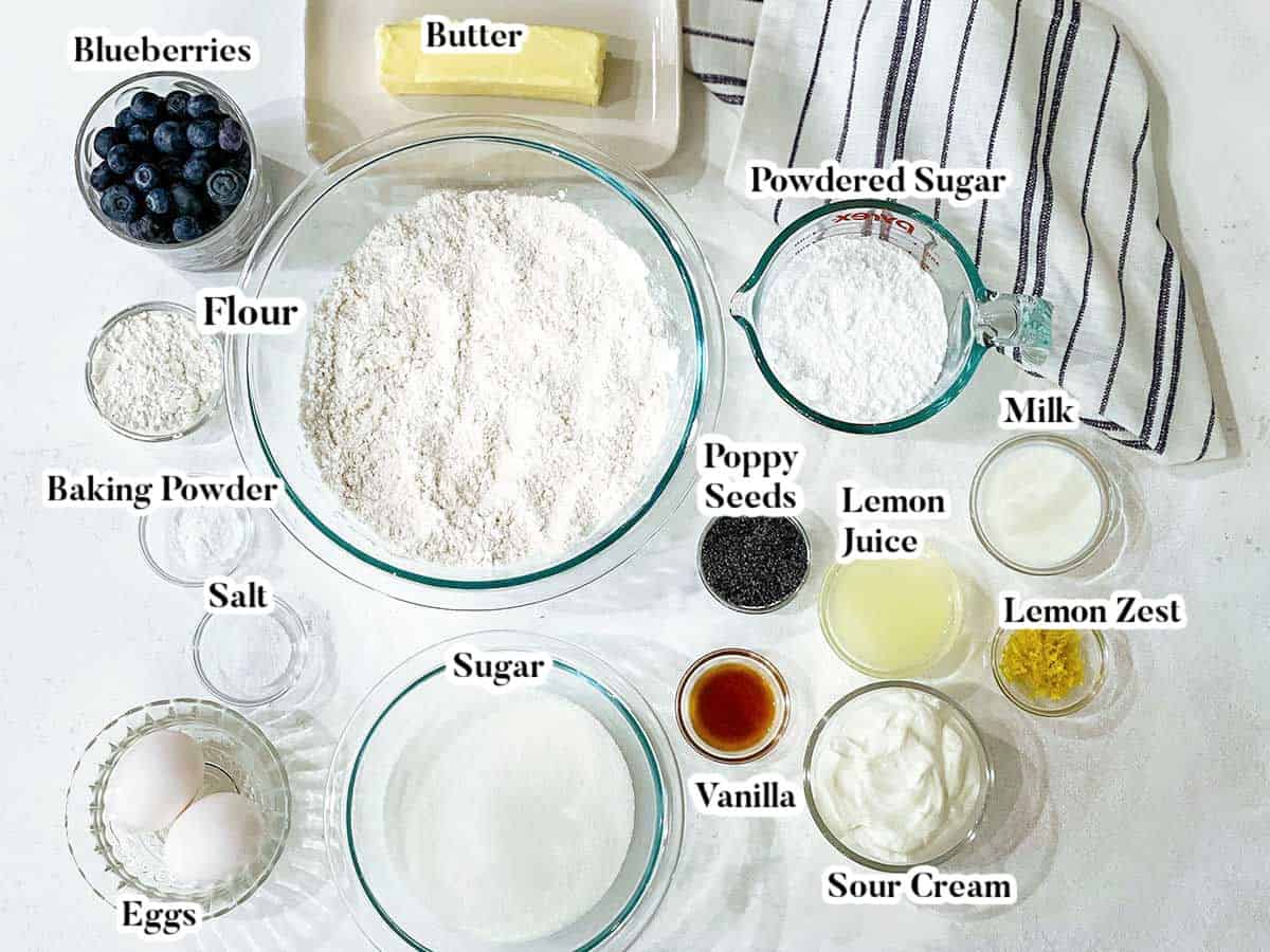 Labeled image of Ingredients to make lemon blueberry poppy seed muffins.