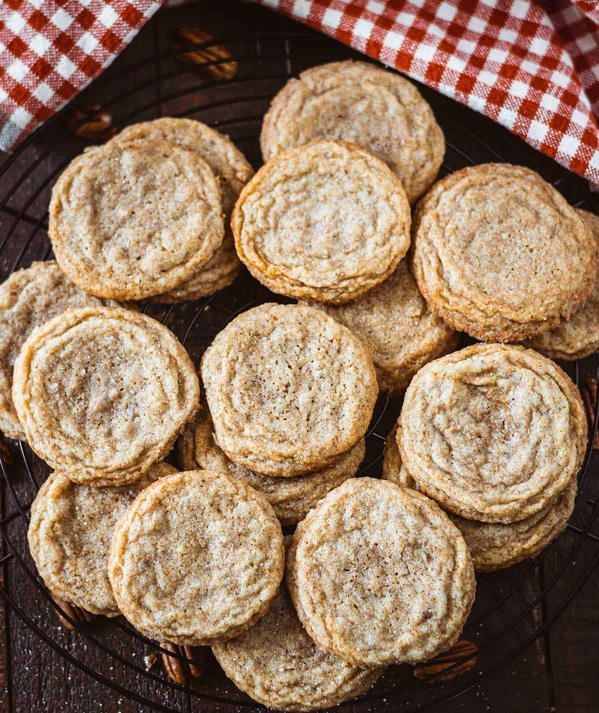 Overhead shot of pecan butter cookies on a wire baking rack.