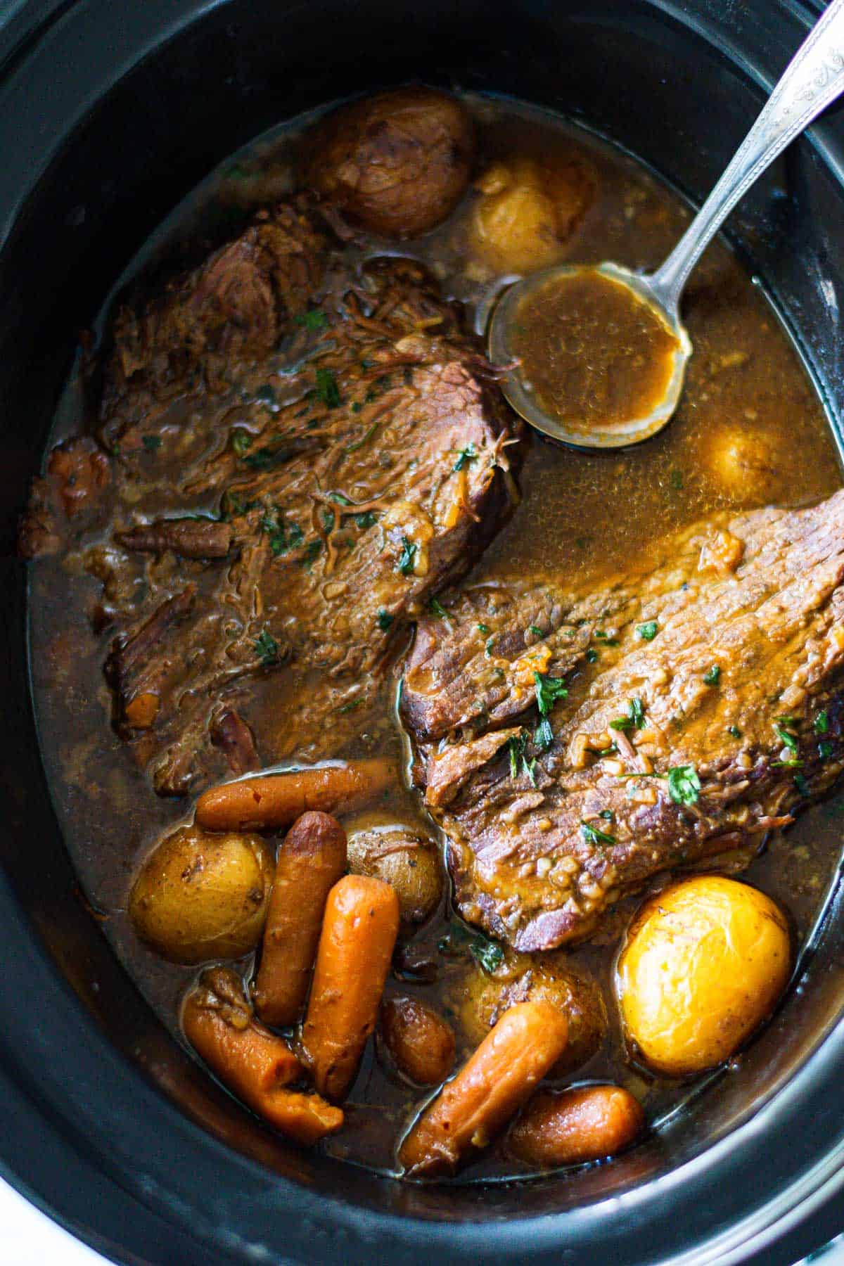 3-packet pot roast in the slow cooker with potatoes and carrots.