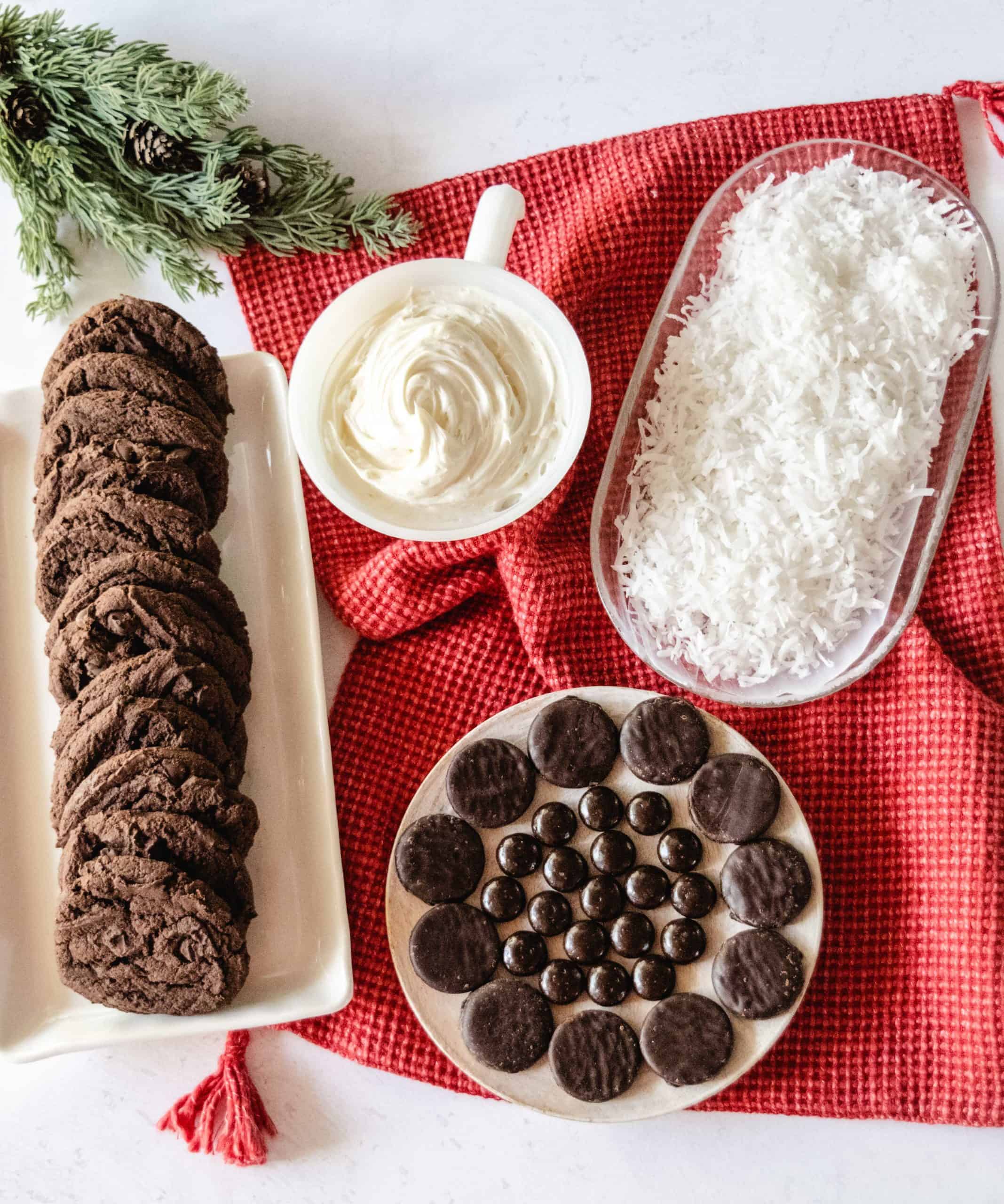 Ingredient image for polar bear cookies, including chocolate cookies, vanilla icing, coconut flakes, peppermint patties, and junior mints.