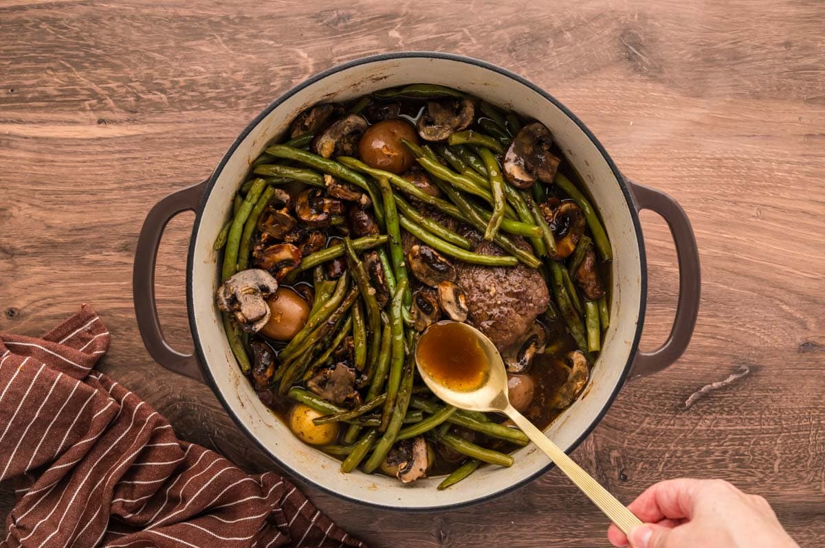Spoon braising liquids over the roast and vegetables half way through cooking.