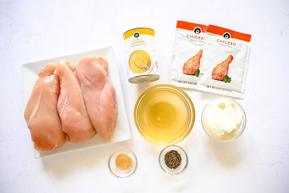 Labeled ingredients needed for slow cooker chicken and gravy.