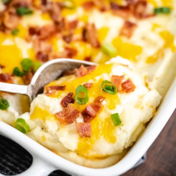 Upclose image of a scoop of mashed potato casserole.