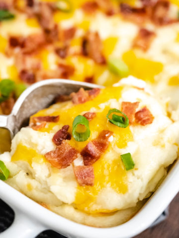 Upclose image of a scoop of mashed potato casserole.