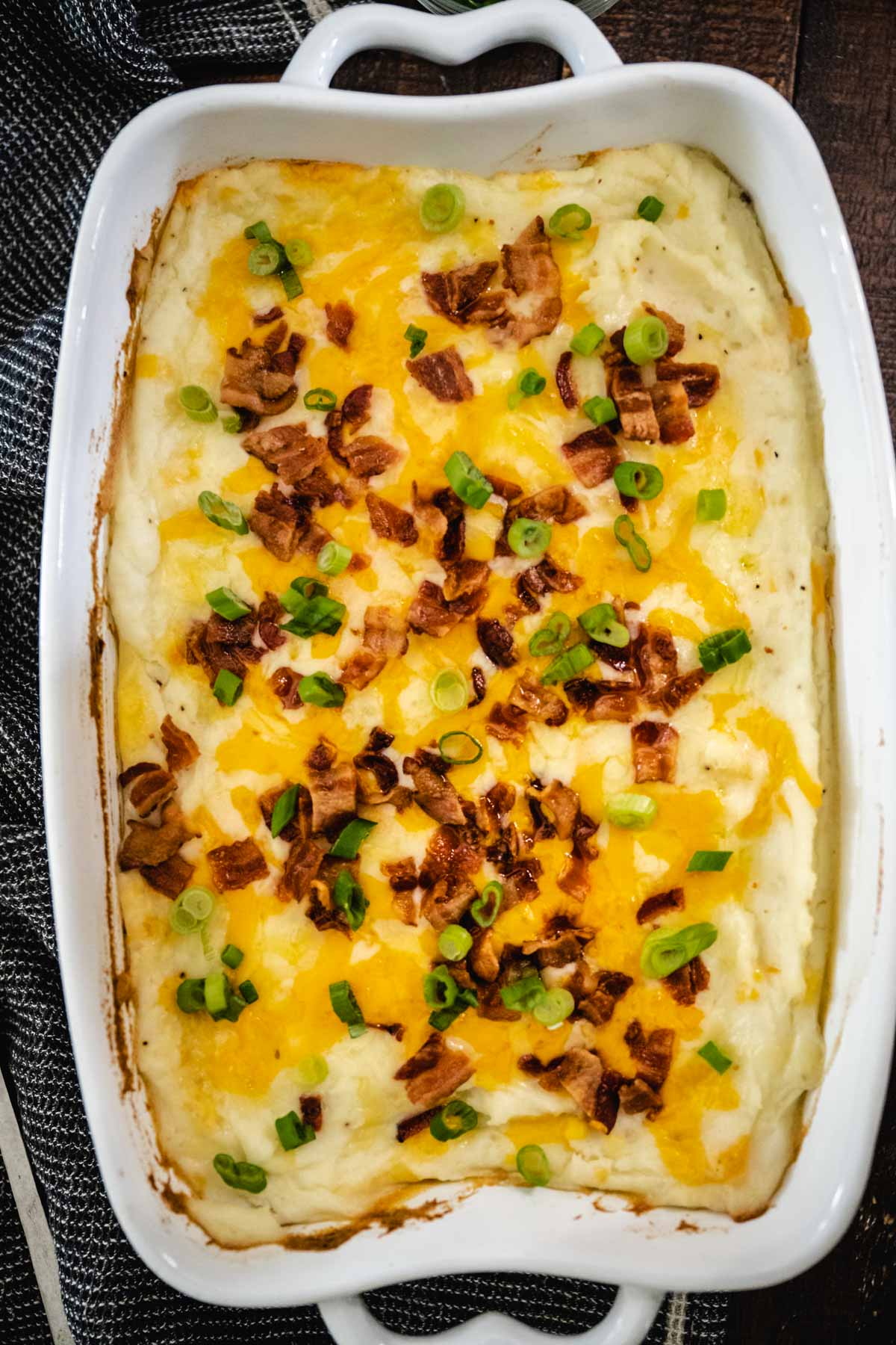 Overhead image of loaded mashed potato casserole after being baked.