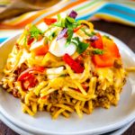 Up Close feature image of plated taco spaghetti bake with taco toppings.