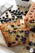 Pinterest image of blueberry banana bread sliced.