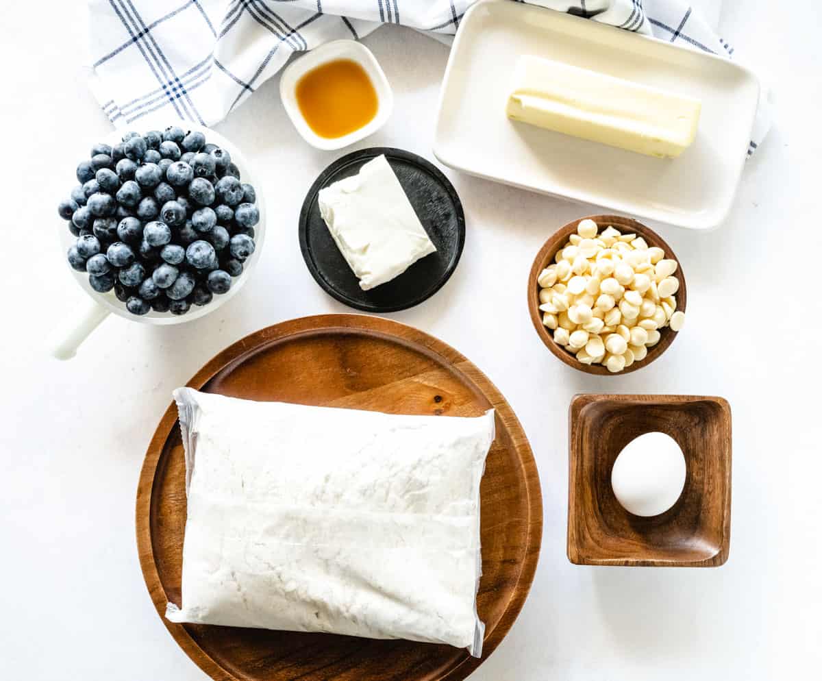 Image of ingredients to make blueberry cheesecake cookies.