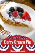 A slice on a white plate of Patriotic Berry Cream Pie Pin 2