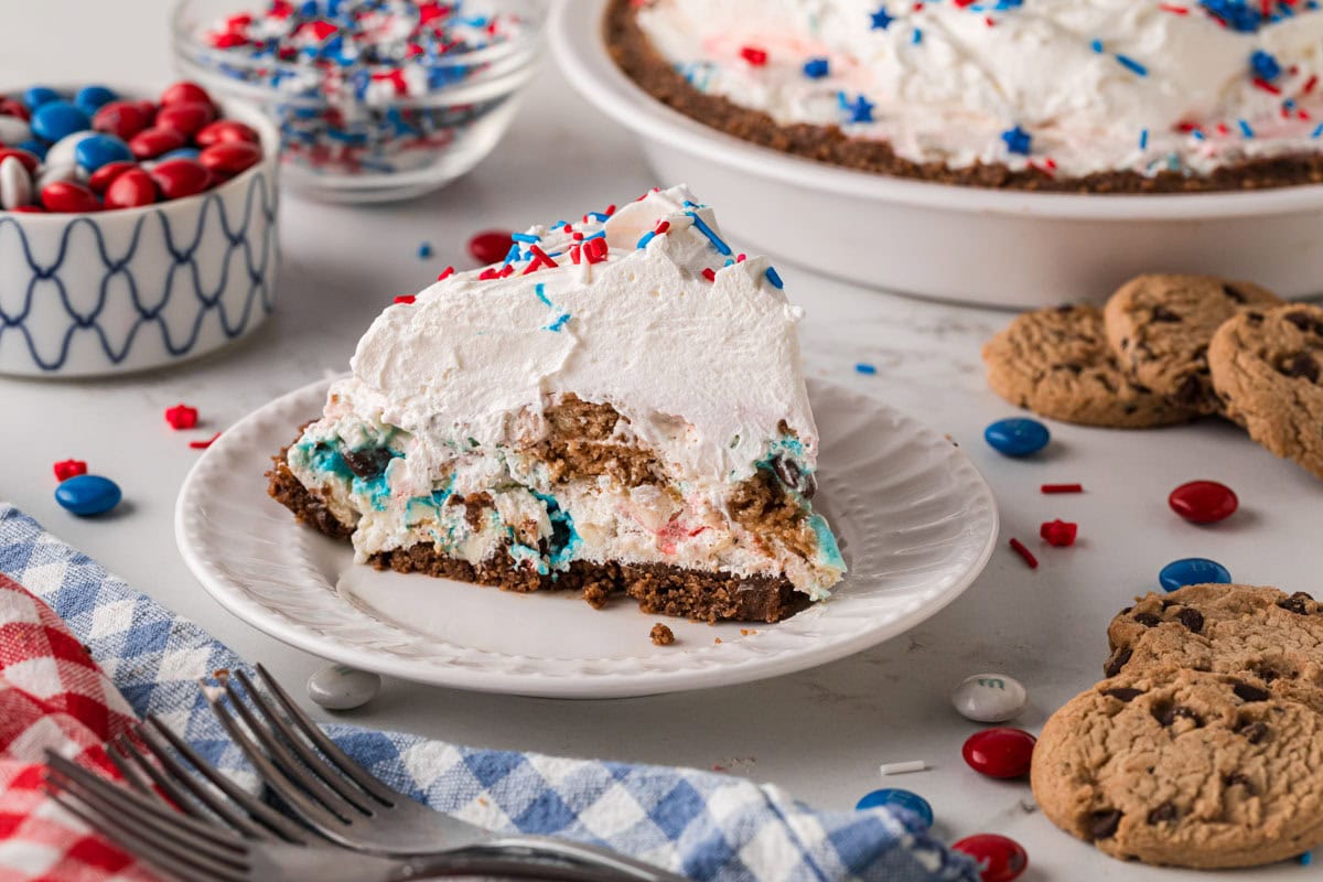 Chocolate chip cookie cream pie with a no bake cookie crust on a white plate