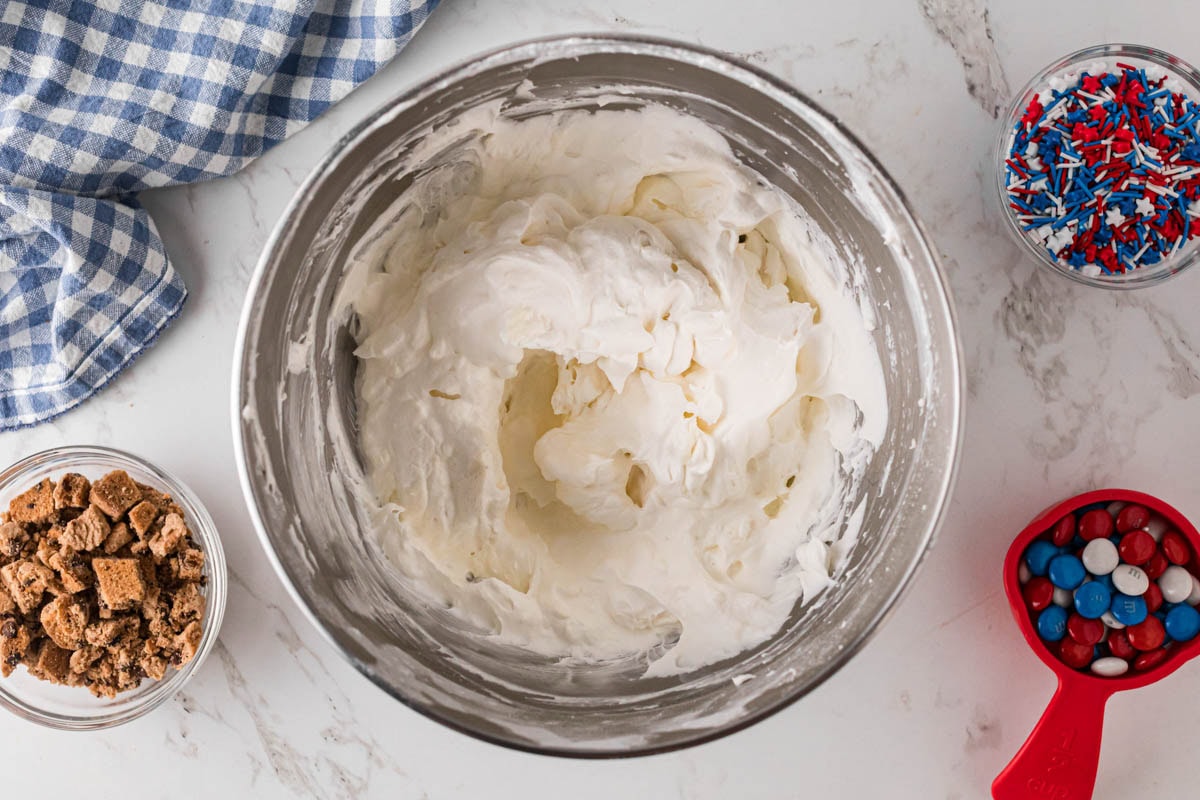 Whipped topping folded into cream cheese mixture.