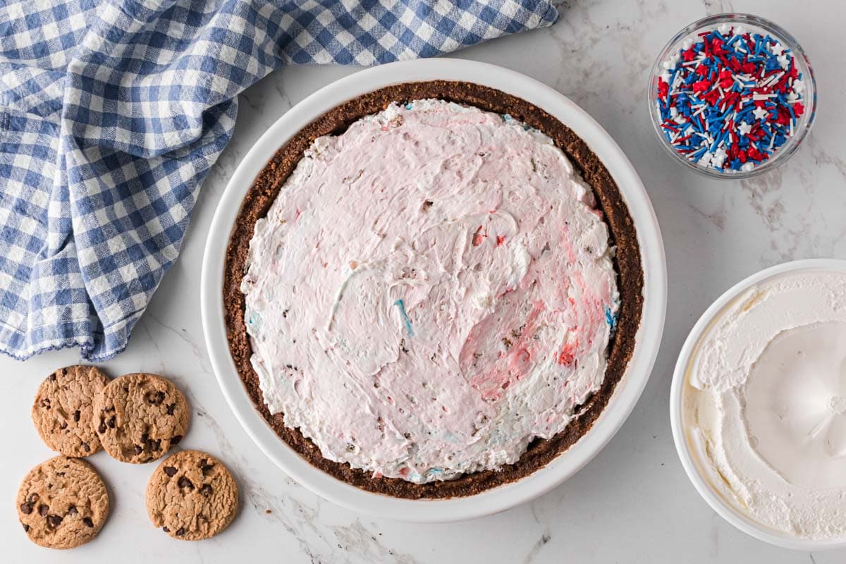 Creamy pie filling added to pie crust.