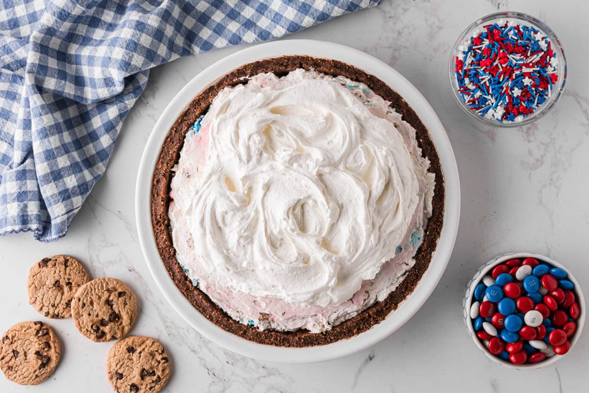 Whipped topping added to the top of pie.