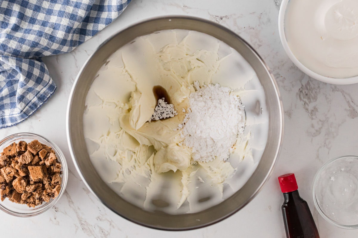 Cream cheese, powdered sugar and vanilla in a stand mixer bowl.