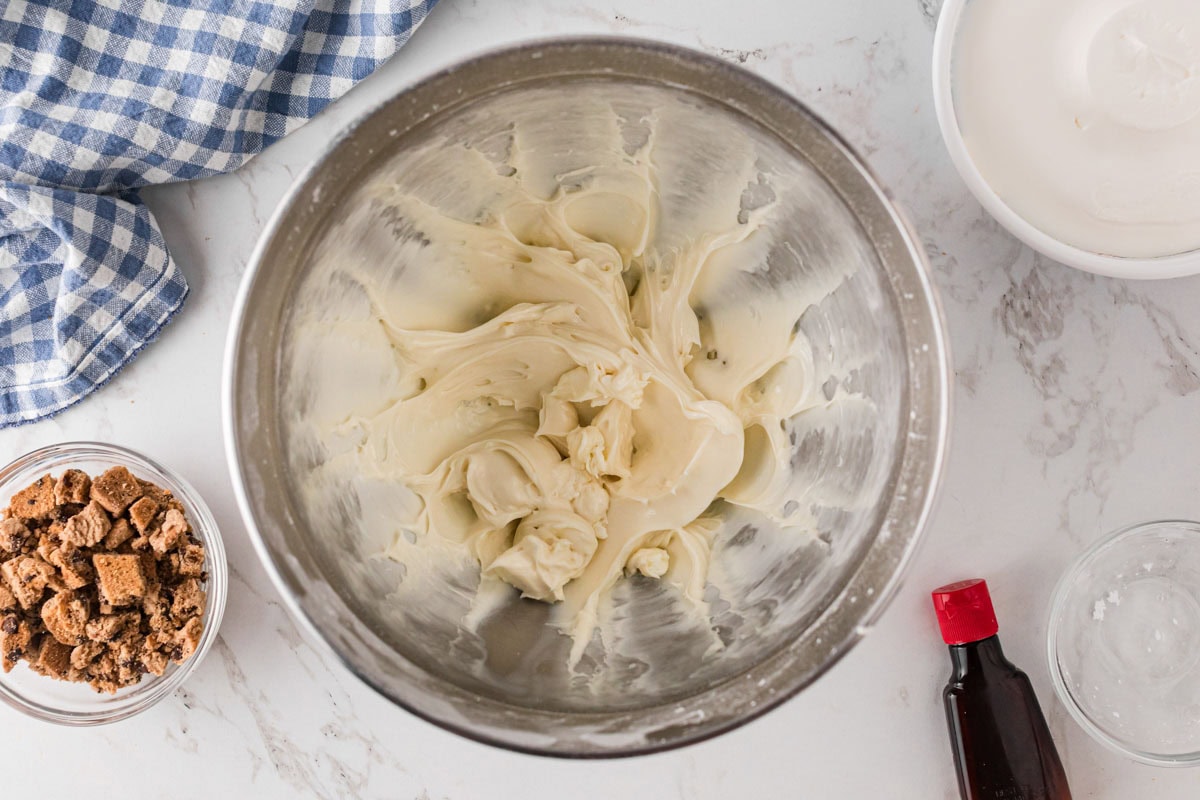 Cream cheese, powdered sugar and vanilla whipped together in a stand mixer bowl.