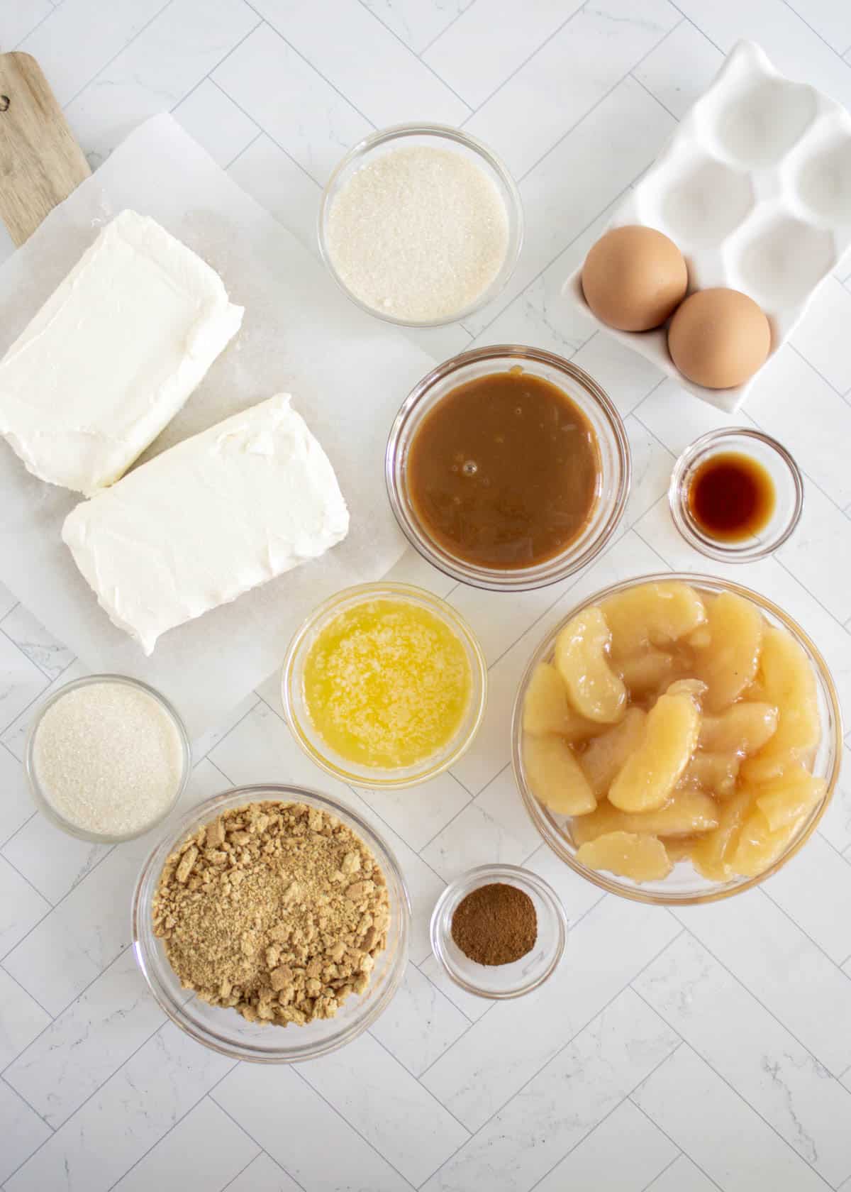 Image of ingredients needed to make caramel apple mini cheesecakes.