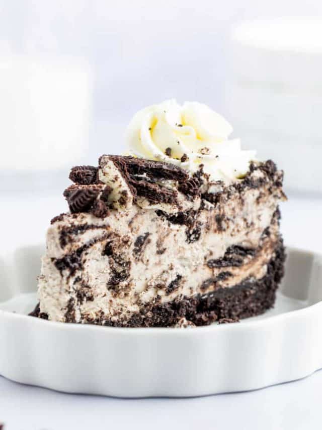 Upclose image of a slice of Oreo cheesecake.