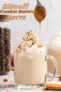 Biscoff Cookie Butter Latte Pinterest image with a cup of latte topped being drizzled with melted cookie butter.