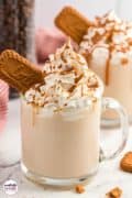 Biscoff Cookie Butter Latte Pinterest image with two cups of latte topped with whipped cream and a biscoff cookie.