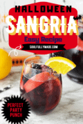 Pinterest image of a glass of halloween sangria with text stating its the perfect party punch.