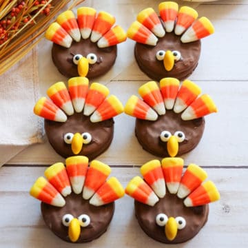 Six chocolate Nutter Butter cookies decorates like cute turkeys.