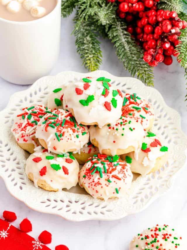 A white plate full of Italian Ricotta Christmas Cookies.