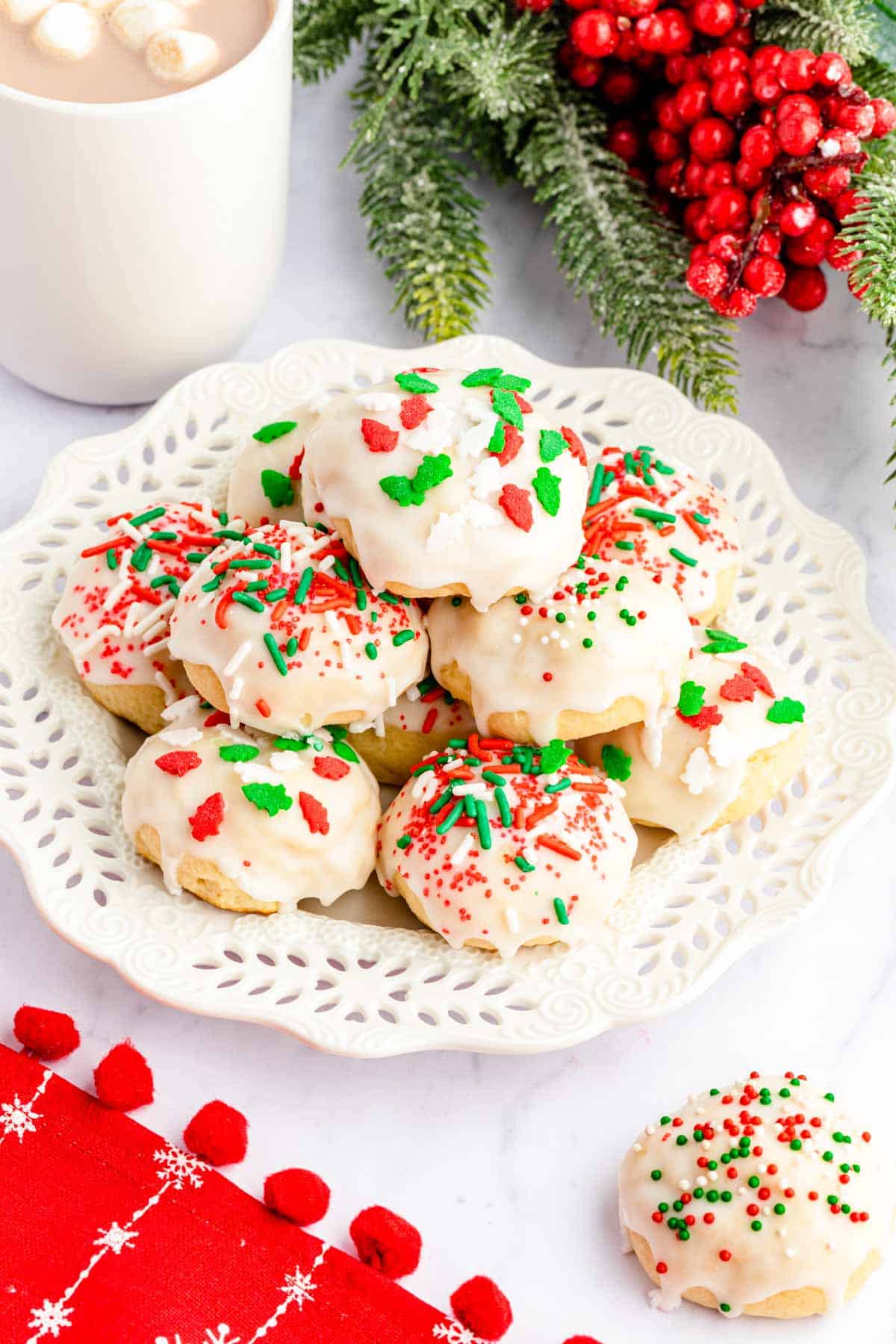 A white plate full of Italian Ricotta Christmas Cookies.