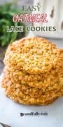 A stack of oatmeal lace cookies on parchment paper.