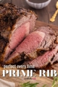 Prime rib recipe sliced and laying on a cutting board.