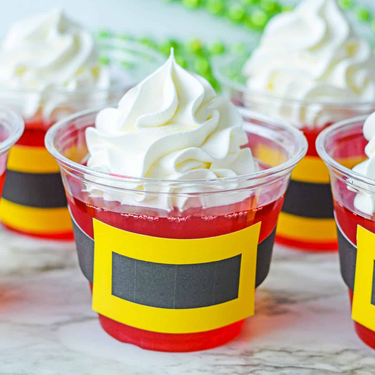 A Santa Jello Cup topped with whipped cream.