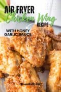 Air Fryer Chicken Wing Recipe close up pin of the wings on a white plate.