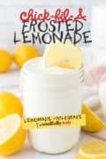 Chick-Fil-A Frosted Lemonade image for Pinterest of a mason jar filled and a slice of lemon garnish.