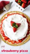 A whole cookie crust strawberry pizza topped with sweetened cream cheese, sliced fresh strawberries, and whipped topping.