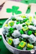 A bowl of St Patrick's Day puppy Chow snack mix.