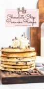 An image of chocolate chip pancakes on a wooden board with chocolate chips scattered.