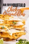 Pinterest image of Air fryer buffalo quesadillas on a wooden board.