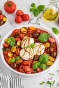 Burrata Caprese Salad Recipe is ready to eat and made with ripe tomatoes, creamy burrata cheese, fresh basil, and a drizzle of balsamic glaze, this salad is bursting with flavor and texture.