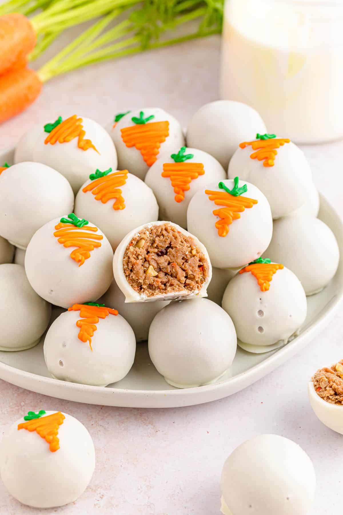 Carrot Cake balls stacked on a serving plate.