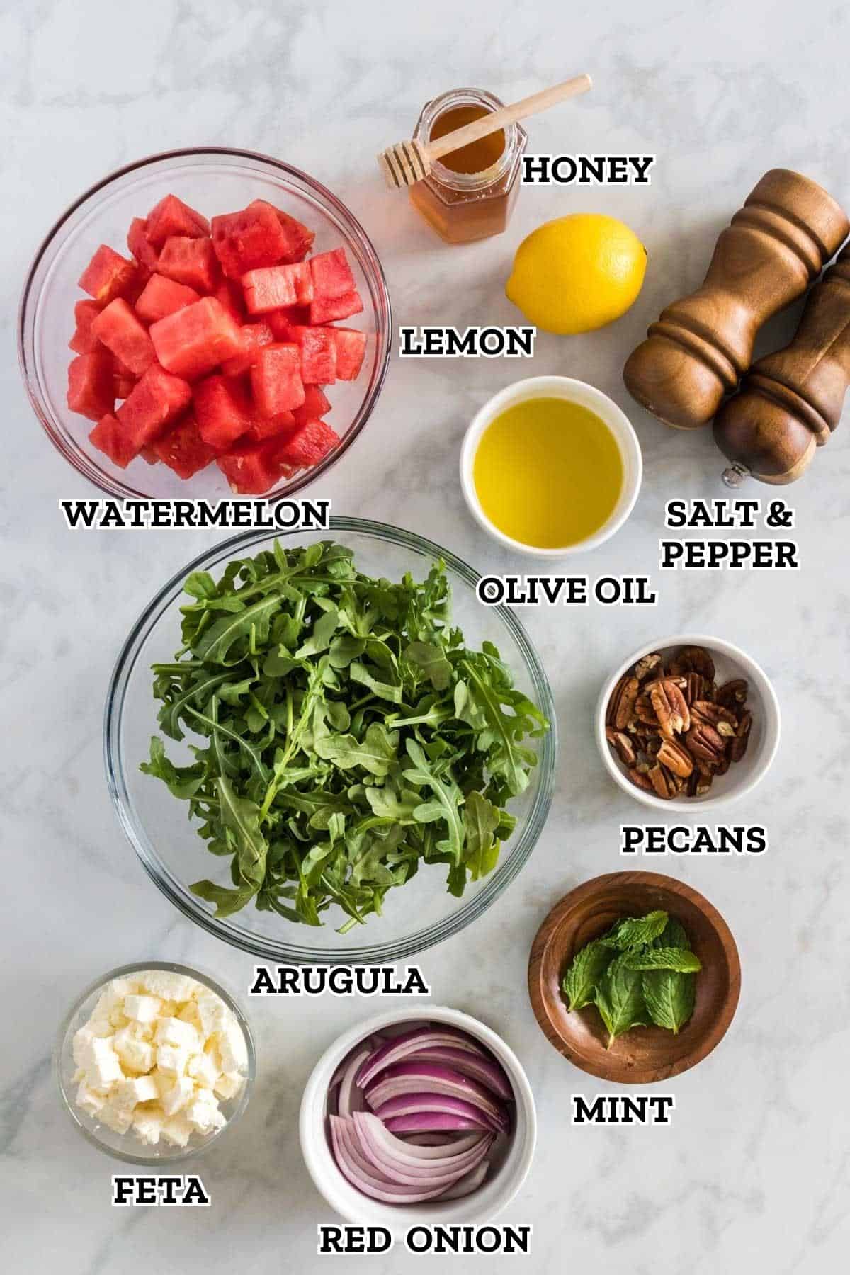 Image of labeled ingredients needed to make watermelon arugula feta salad.