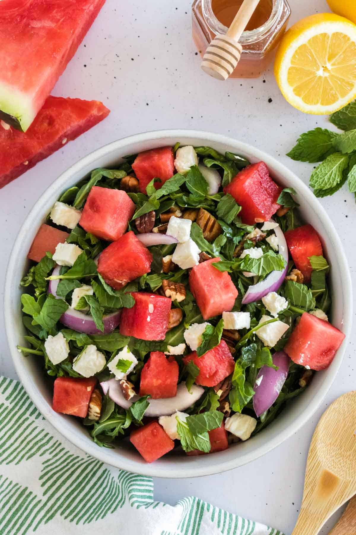 An arugula salad with watermelon and feta.