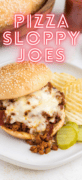A white plate with a pizza sloppy joe sandwich with chips.