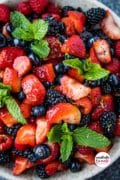 Pin4 for the Summer Berry Fruit Salad- a closeup of all the berries in a white bowl.