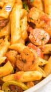 Zoomed in picture of a bowl filled with Cajun Jambalaya Pasta with shrimp and sausage.