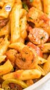 Zoomed in picture of a bowl filled with Cajun Jambalaya Pasta with shrimp and sausage.