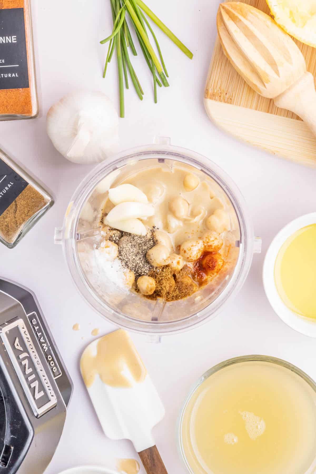 Ingredients for creamy garlic hummus added to the blender.