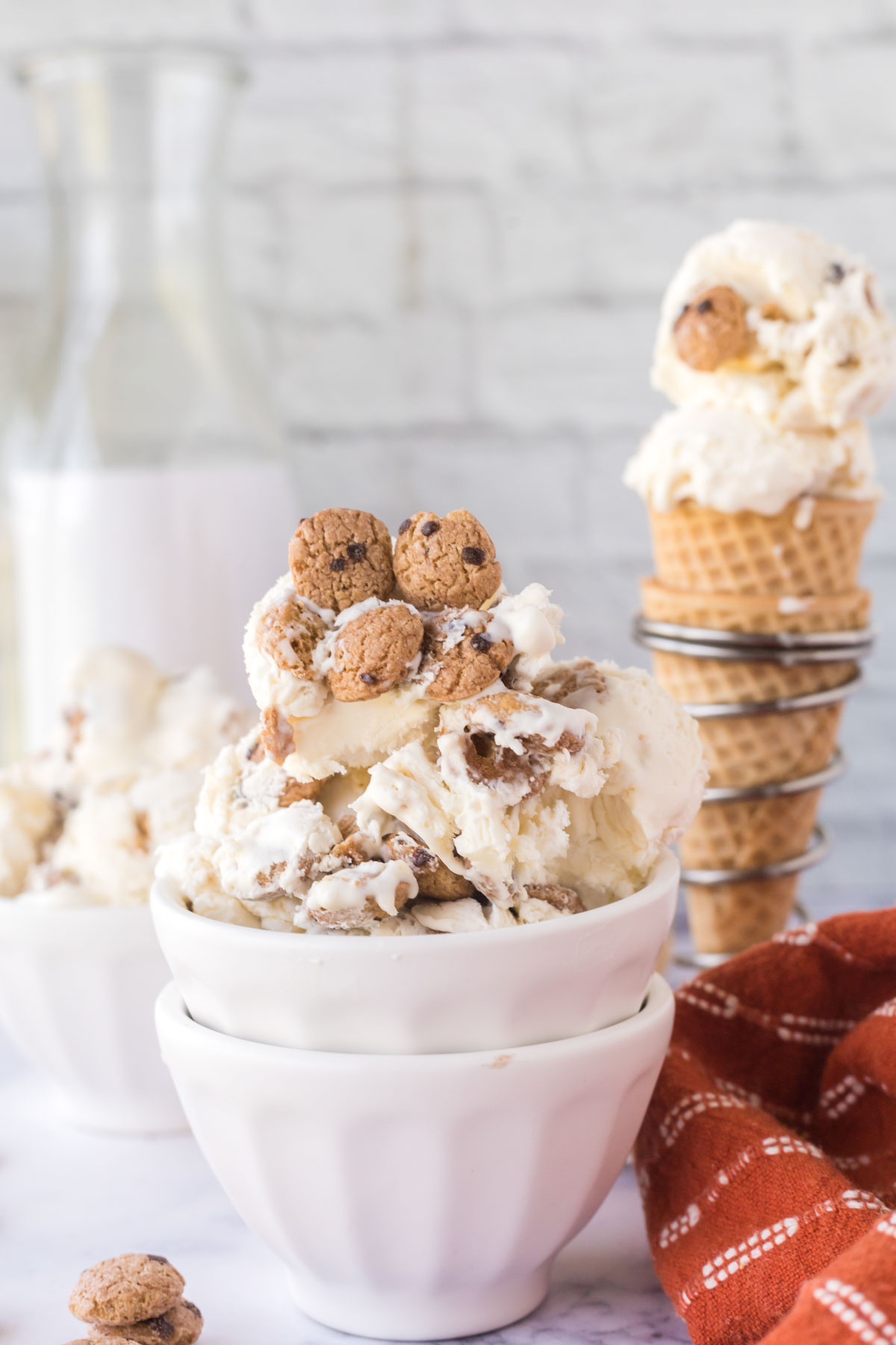 A white bowl filled with chocolate chip cookie ice cream.