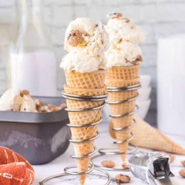 Two waffle cones filled with no-churn chocolate chip cookie ice cream.